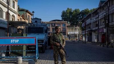 A soldier standing guard on a street in Srinagar on Tuesday, exactly a week since the attack on tourists near Pahalgam in south Kashmir. (Reuters)