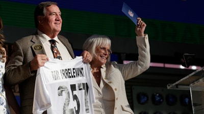 Melanie Salata Fitch, right, announces Memphis' Kobee Minor as the final pick by New England Patriots the during the third day of the NFL football draft, Saturday, April 26, 2025, in Green Bay, Wis. (AP Photo/Matt Ludtke) (AP) Melanie Salata Fitch, right, announces Memphis' Kobee Minor as the final pick by New England Patriots the during the third day of the NFL football draft, Saturday, April 26, 2025, in Green Bay, Wis. (AP Photo/Matt Ludtke) (AP)