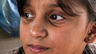 A young Pakistani national gets emotional as she arrives at the Integrated Check Post at Attari-Wagah border to move to her country without her mother, who holds an Indian passport, near Amritsar on Sunday, April 27, 2025. (PTI) A young Pakistani national gets emotional as she arrives at the Integrated Check Post at Attari-Wagah border to move to her country without her mother, who holds an Indian passport, near Amritsar on Sunday, April 27, 2025. (PTI)