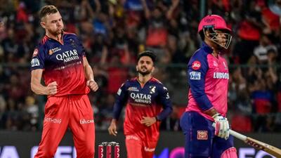RCB’s Josh Hazlewood (L) celebrates after taking the wicket of RR’s Shimron Hetmyer. (AFP) RCB’s Josh Hazlewood (L) celebrates after taking the wicket of RR’s Shimron Hetmyer. (AFP)