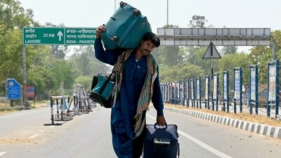 An Indian citizen returns from Pakistan through the India-Pakistan Wagah border post, about 35 km from Amritsar on April 28, 2025, after Islamabad revoked visas of Indian nationals in response to New Delhi's withdrawal of visas for Pakistanis. (AFP) An Indian citizen returns from Pakistan through the India-Pakistan Wagah border post, about 35 km from Amritsar on April 28, 2025, after Islamabad revoked visas of Indian nationals in response to New Delhi's withdrawal of visas for Pakistanis. (AFP)