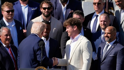 President Donald Trump, left, shakes the hand of Philadelphia Eagles NFL football player Cooper DeJean. (AP) President Donald Trump, left, shakes the hand of Philadelphia Eagles NFL football player Cooper DeJean. (AP)