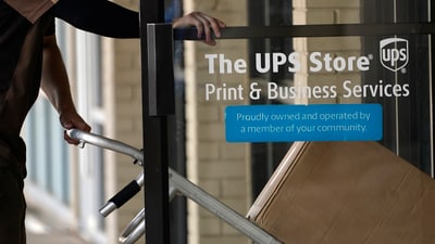 FILE -  A UPS driver enters a United Parcel Service store with packages in Jackson, Miss., Monday, July 26, 2021.AP Photo/Rogelio V. Solis, File) (AP)