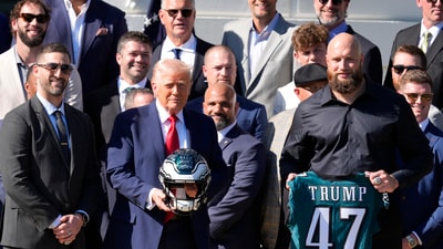 Philadelphia Eagles head coach Nick Sirianni, left, and offensive tackle Lane Johnson stand next to President Donald Trump as he honors the Super Bowl LIX champion Philadelphia Eagles at The White House in Washington D.C., on April 28, 2025. Mandatory Credit: Josh Morgan-USA TODAY via Imagn Images (IMAGN IMAGES via Reuters Connect)