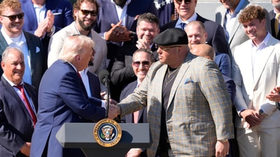 Trump (L) greets Philadelphia Eagles head of security Dominick DiSandro as President Donald Trump honors the Super Bowl LIX champion Philadelphia Eagles at The White House in Washington D.C., on April 28, 2025. Mandatory Credit: Josh Morgan-USA TODAY via Imagn Images (IMAGN IMAGES via Reuters Connect)