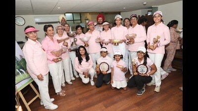 Winners of the two-day tournament posing with their trophies at the Chandigarh Golf Club on Tuesday. (HT Photo)