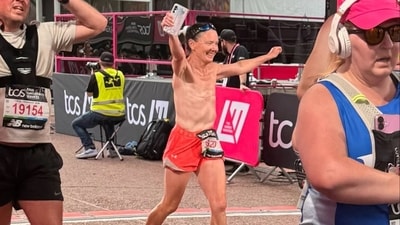 Breast cancer survivor, Louise Bernadette Butcher, runs during the London marathon. Breast cancer survivor, Louise Bernadette Butcher, runs during the London marathon.