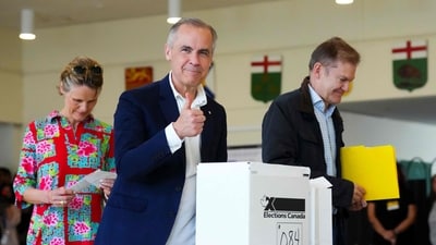 Canadian Prime Minister and Liberal leader Mark Carney, alongside his wife Diana Fox Carney (L), gives a thumbs up after casting his ballot a polling station during the federal election in Ottawa. (AFP) Canadian Prime Minister and Liberal leader Mark Carney, alongside his wife Diana Fox Carney (L), gives a thumbs up after casting his ballot a polling station during the federal election in Ottawa. (AFP)