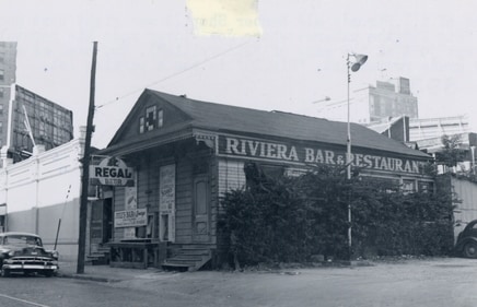 Site of Arman J. Piren’s old barber shop. It was almost next to “Big 25”, the cabaret where Joe “King” Oliver made his reputation. The bands would all congregate here and practice. The building was also a restaurant before being torn down in 1959. The space is now part of a parking lot (Photo courtesy: Louisiana State Museum) Site of Arman J. Piren’s old barber shop. It was almost next to “Big 25”, the cabaret where Joe “King” Oliver made his reputation. The bands would all congregate here and practice. The building was also a restaurant before being torn down in 1959. The space is now part of a parking lot (Photo courtesy: Louisiana State Museum)