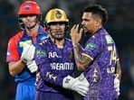 Kolkata Knight Riders' Sunil Narine (R) celebrates with wicketkeeper Rahmanullah Gurbaz (C) after taking the wicket of Delhi Capitals' Tristan Stubbs