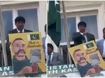 Pak's Colonel Taimur Rahat was also spotted holding a poster featuring a sketch of IAF pilot Captain Abhinandan Varthaman. Pak's Colonel Taimur Rahat was also spotted holding a poster featuring a sketch of IAF pilot Captain Abhinandan Varthaman.