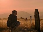 Ellie mourns at Joel's grave before embarking the WLF hunting in the HBO's The Last Of Us 2.(HBO)