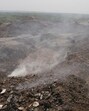 Smoke rising from a waste treatment plant on the Gurugram-Faridabad Road near Bandhwari village in Gurugram on Wednesday. (PARVEEN KUMAR/HT) Smoke rising from a waste treatment plant on the Gurugram-Faridabad Road near Bandhwari village in Gurugram on Wednesday. (PARVEEN KUMAR/HT)