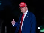 President Donald Trump gestures to reporters as he walks on the South Lawn of the White House in Washington, Tuesday, April 29, 2025. 
