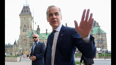 Canada's Prime Minister Mark Carney speaks to the media upon arriving at his office on Parliament Hill, in Ottawa, on Tuesday. (AFP) Canada's Prime Minister Mark Carney speaks to the media upon arriving at his office on Parliament Hill, in Ottawa, on Tuesday. (AFP)