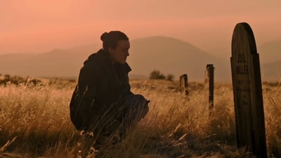 Ellie mourns at Joel's grave before embarking the WLF hunting in the HBO's The Last Of Us 2. (HBO) Ellie mourns at Joel's grave before embarking the WLF hunting in the HBO's The Last Of Us 2. (HBO)