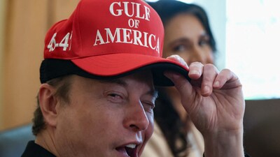 Tesla CEO Elon Musk reacts while wearing a cap with the words "Gulf of America" (REUTERS)
