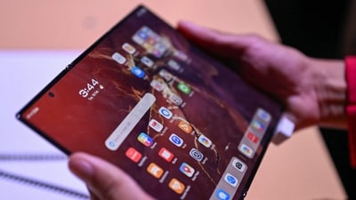 Samsung is expected to unveil its first tri-fold smartphone, which could be called the Galaxy G Fold. (Representative image) (AFP) Samsung is expected to unveil its first tri-fold smartphone, which could be called the Galaxy G Fold. (Representative image) (AFP)