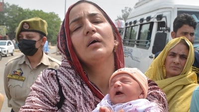 Pakistani citizen Sara Khan, mother of two kids, at the India-Pakistan Wagah border Post in Amritsar on Wednesday. (HT Photo) Pakistani citizen Sara Khan, mother of two kids, at the India-Pakistan Wagah border Post in Amritsar on Wednesday. (HT Photo)