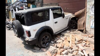 The Mahindra Thar that rammed into a biker and dragged him before crashing into a nearby godown in Ludhiana’s Rishi Nagar on Wednesday. (HT Photo) The Mahindra Thar that rammed into a biker and dragged him before crashing into a nearby godown in Ludhiana’s Rishi Nagar on Wednesday. (HT Photo)