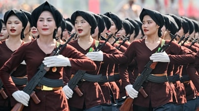 Participants march during a parade marking the 50th anniversary of the fall of Saigon and the end of the Vietnam War in Ho Chi Minh City on April 30, 2025. Vietnam held its biggest celebration of the fall of Saigon on its 50th anniversary on April 30, including Chinese troops for the first time after Xi Jinping visited to portray Beijing as a more reliable partner than Washington. (Photo by NHAC NGUYEN / AFP) (AFP) Participants march during a parade marking the 50th anniversary of the fall of Saigon and the end of the Vietnam War in Ho Chi Minh City on April 30, 2025. Vietnam held its biggest celebration of the fall of Saigon on its 50th anniversary on April 30, including Chinese troops for the first time after Xi Jinping visited to portray Beijing as a more reliable partner than Washington. (Photo by NHAC NGUYEN / AFP) (AFP)