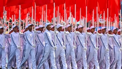 Participants holding flags march during a parade marking the 50th anniversary of the fall of Saigon and the end of the Vietnam War in Ho Chi Minh City on April 30, 2025. Vietnam held its biggest celebration of the fall of Saigon on its 50th anniversary on April 30, including Chinese troops for the first time after Xi Jinping visited to portray Beijing as a more reliable partner than Washington. (Photo by NHAC NGUYEN / AFP) (AFP) Participants holding flags march during a parade marking the 50th anniversary of the fall of Saigon and the end of the Vietnam War in Ho Chi Minh City on April 30, 2025. Vietnam held its biggest celebration of the fall of Saigon on its 50th anniversary on April 30, including Chinese troops for the first time after Xi Jinping visited to portray Beijing as a more reliable partner than Washington. (Photo by NHAC NGUYEN / AFP) (AFP)