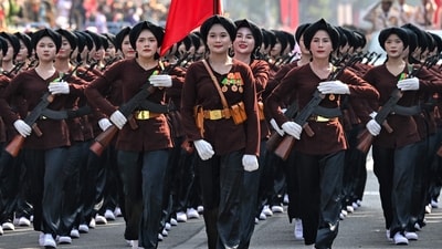 Participants march during a parade marking the 50th anniversary of the fall of Saigon and the end of the Vietnam War in Ho Chi Minh City on April 30, 2025. Vietnam held its biggest celebration of the fall of Saigon on its 50th anniversary on April 30, including Chinese troops for the first time after Xi Jinping visited to portray Beijing as a more reliable partner than Washington. (Photo by NHAC NGUYEN / AFP) (AFP) Participants march during a parade marking the 50th anniversary of the fall of Saigon and the end of the Vietnam War in Ho Chi Minh City on April 30, 2025. Vietnam held its biggest celebration of the fall of Saigon on its 50th anniversary on April 30, including Chinese troops for the first time after Xi Jinping visited to portray Beijing as a more reliable partner than Washington. (Photo by NHAC NGUYEN / AFP) (AFP)