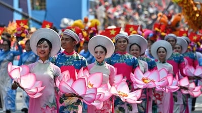 Participants march during a parade marking the 50th anniversary of the fall of Saigon and the end of the Vietnam War in Ho Chi Minh City on April 30, 2025. Vietnam held its biggest celebration of the fall of Saigon on its 50th anniversary on April 30, including Chinese troops for the first time after Xi Jinping visited to portray Beijing as a more reliable partner than Washington. (Photo by NHAC NGUYEN / AFP) (AFP) Participants march during a parade marking the 50th anniversary of the fall of Saigon and the end of the Vietnam War in Ho Chi Minh City on April 30, 2025. Vietnam held its biggest celebration of the fall of Saigon on its 50th anniversary on April 30, including Chinese troops for the first time after Xi Jinping visited to portray Beijing as a more reliable partner than Washington. (Photo by NHAC NGUYEN / AFP) (AFP)