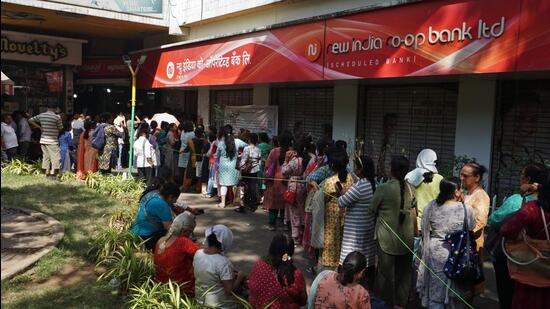 Thane, India - February 14, 2025: Panic spreads among account holders at New India Co-op Bank Thane Vasant Vihar branch after RBI restrictions, Account holders are seen crowding outside Thane branch at vasant vihaar in thane to remove valuables from their lockers ,in Thane,in Mumbai, India, on, Friday, February -14, 2024. ( Praful Gangurde /HT Photo )
