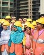Delhi CM Rekha Gupta interacts with workers at a construction site on New Rohtak Road. (Vipin Kumar/HT Photo)
