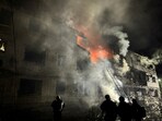 Rescuers work at the site of an apartment building hit by a Russian drone strike, amid Russia's attack on Ukraine.