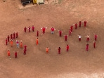 A drone view of detainees forming the letters SOS with their bodies in the courtyard at the Bluebonnet Detention Facility, where Venezuelans at the center of a U.S. Supreme Court ruling are held, in Anson, Texas, U.S. April 28, 2025. REUTERS/Paul Ratje     TPX IMAGES OF THE DAY