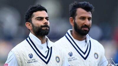 India's Virat Kohli (L) and India's Cheteshwar Pujara (AFP) India's Virat Kohli (L) and India's Cheteshwar Pujara (AFP)