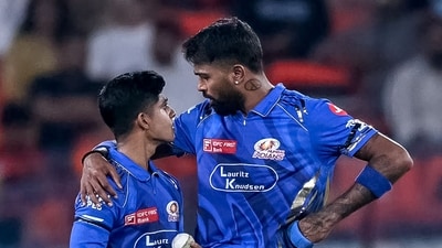 Mumbai Indians' captain Hardik Pandya (R) speaks with Vignesh Puthur (AFP) Mumbai Indians' captain Hardik Pandya (R) speaks with Vignesh Puthur (AFP)