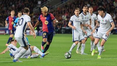 FC Barcelona's Lamine Yamal in action with Inter Milan's Alessandro Bastoni. (REUTERS) FC Barcelona's Lamine Yamal in action with Inter Milan's Alessandro Bastoni. (REUTERS)