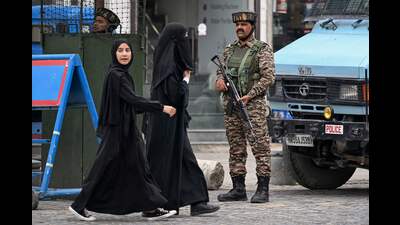 Indian paramilitary personnel stand guard as schoolgirls walk along a street in Srinagar on Thursday. (AFP) Indian paramilitary personnel stand guard as schoolgirls walk along a street in Srinagar on Thursday. (AFP)