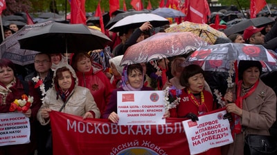 Russian Communist Party's supporters with poster reading "Our goal is socialism, our banner is red", "first and most importantly - we all work for victory!" gather to mark Labor Day, (AP) Russian Communist Party's supporters with poster reading "Our goal is socialism, our banner is red", "first and most importantly - we all work for victory!" gather to mark Labor Day, (AP)