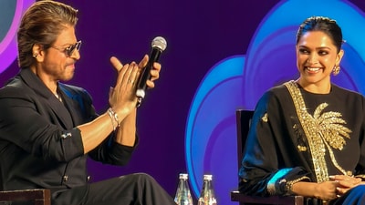 Mumbai: Bollywood actors Shah Rukh Khan and Deepika Padukone during a session titled The Journey: From Outsider to Ruler at the first World Audio Visual and Entertainment Summit (WAVES). (PTI)