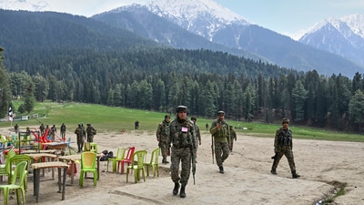 Security officers inspect the site a day after where suspected terrorists opened fire at tourists in Pahalgam. (AP) Security officers inspect the site a day after where suspected terrorists opened fire at tourists in Pahalgam. (AP)