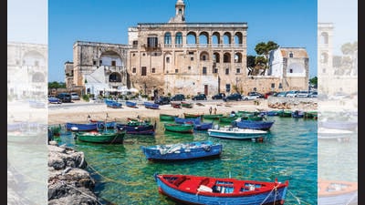 Skip the obvious Italian sights for Polignano a Mare, where cream houses merge into the sea. (ADOBE STOCK) Skip the obvious Italian sights for Polignano a Mare, where cream houses merge into the sea. (ADOBE STOCK)