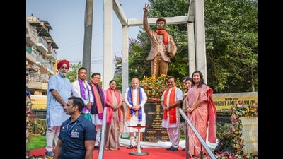 Union home minister Amit Shah unveils statue of Bodofa Upendra Nath Brahma in New Delhi on Thursday. (HT PHOTO)