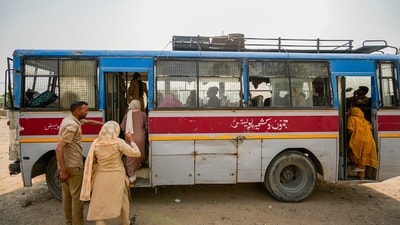 Pakistani nationals crossing over to their home country aboard a bus at Attari border in Amritsar on Wednesday. (PTI) Pakistani nationals crossing over to their home country aboard a bus at Attari border in Amritsar on Wednesday. (PTI)