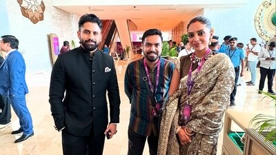Naga Chaitanya and Sobhita Dhulipala pose with a fan at WAVES 2025.