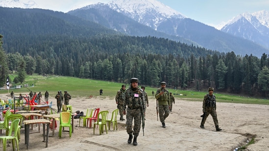 Security officers inspect the site a day after where suspected terrorists opened fire at tourists in Pahalgam. (AP)