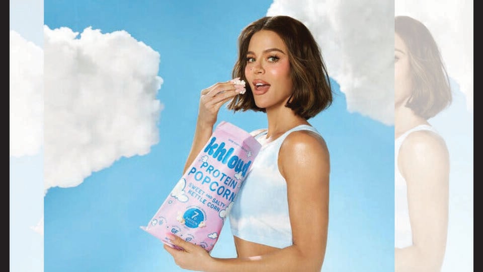Khloé Kardashian just dropped protein-dusted popcorn. Time to Netflix and Shred? (INSTAGRAM/@KHLOUDFOODS)