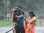 Visitors at Kartavya Path amid rain in New Delhi. The IMD also warned of hailstorm damaging crops and injuring people/cattle standing at open spaces. Visitors at Kartavya Path amid rain in New Delhi. The IMD also warned of hailstorm damaging crops and injuring people/cattle standing at open spaces.