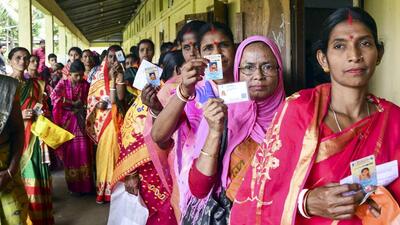People wait to cast their votes during the panchayat elections at Baraigram in Karimganj, Assam, on Friday. (PTI Photo) People wait to cast their votes during the panchayat elections at Baraigram in Karimganj, Assam, on Friday. (PTI Photo)