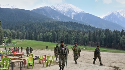 Security officers inspect the site a day after where suspected terrorists opened fire at tourists in Pahalgam. (AP) Security officers inspect the site a day after where suspected terrorists opened fire at tourists in Pahalgam. (AP)