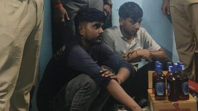 The two accused were caught with nine half-bottles of Imperial Blue filled with country liquor, 90 tetra packs of Twin Tower (labelled for sale in Uttar Pradesh), and several empty bottles of Royal Stag, White and Blue, After Dark, and 8 PM Whisky. (HT Photo)