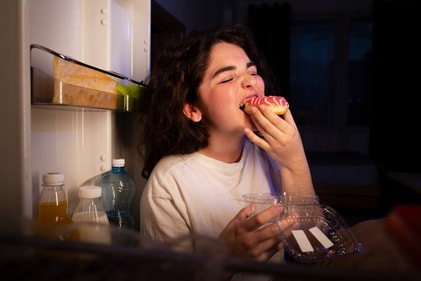 Are you standing in front of the fridge because you are hungry or just bored and having nothing better to do? (Freepik) Are you standing in front of the fridge because you are hungry or just bored and having nothing better to do? (Freepik)